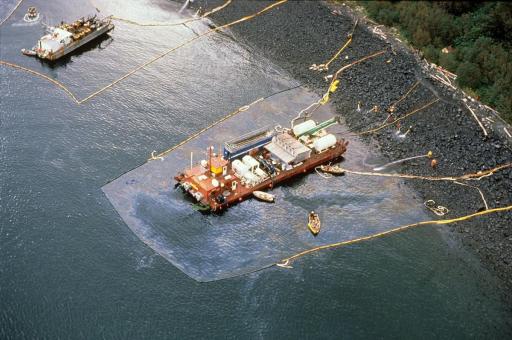 Aerial view of a maxi-barge and spill workers.